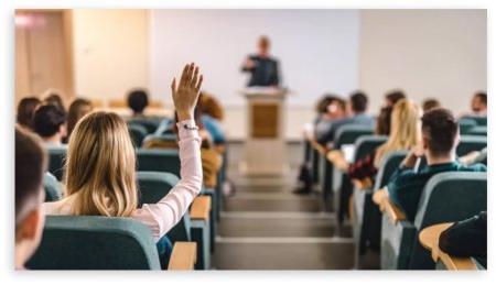 Student raising her hand in ODU class